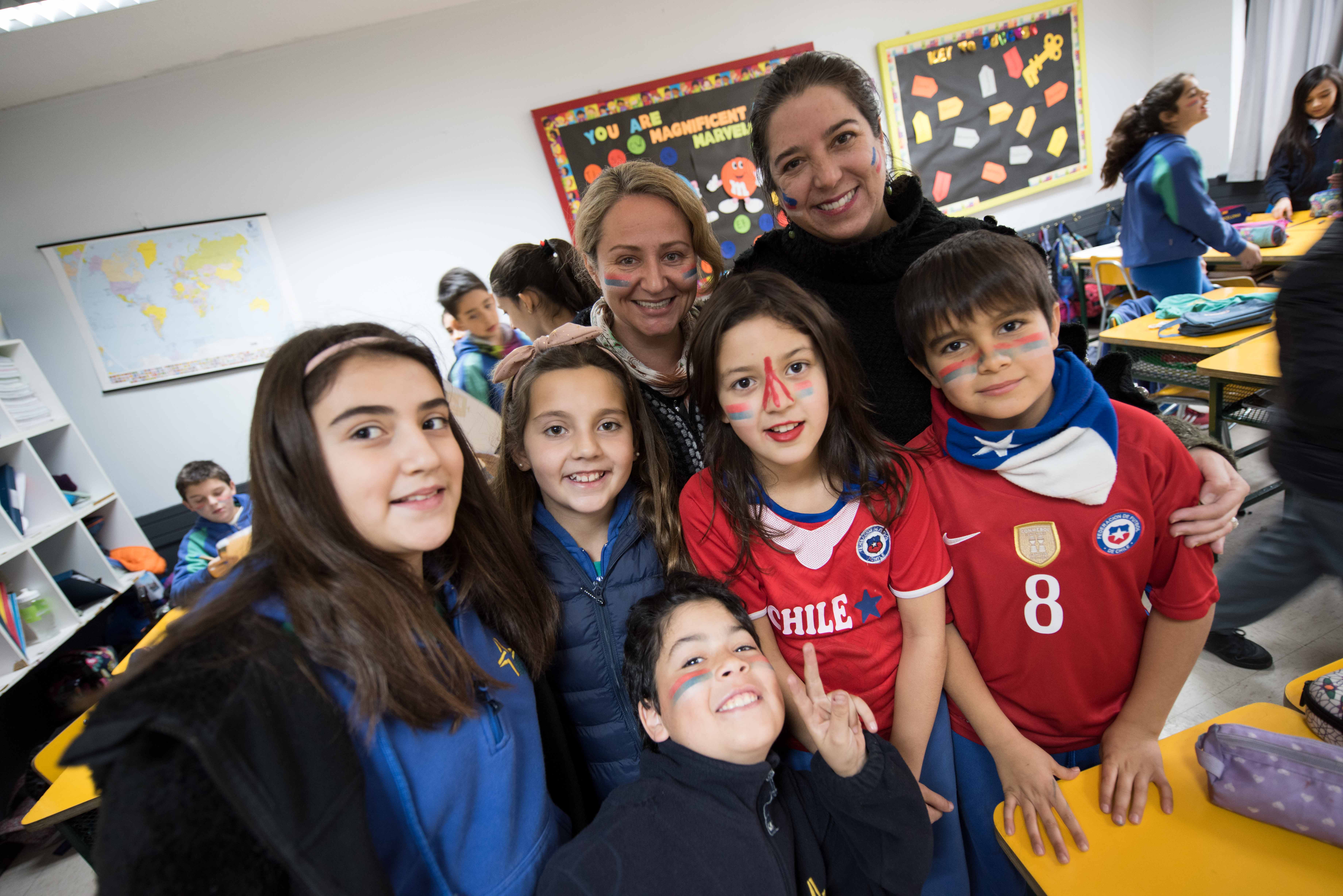 Photo of teacher with students in Chile
