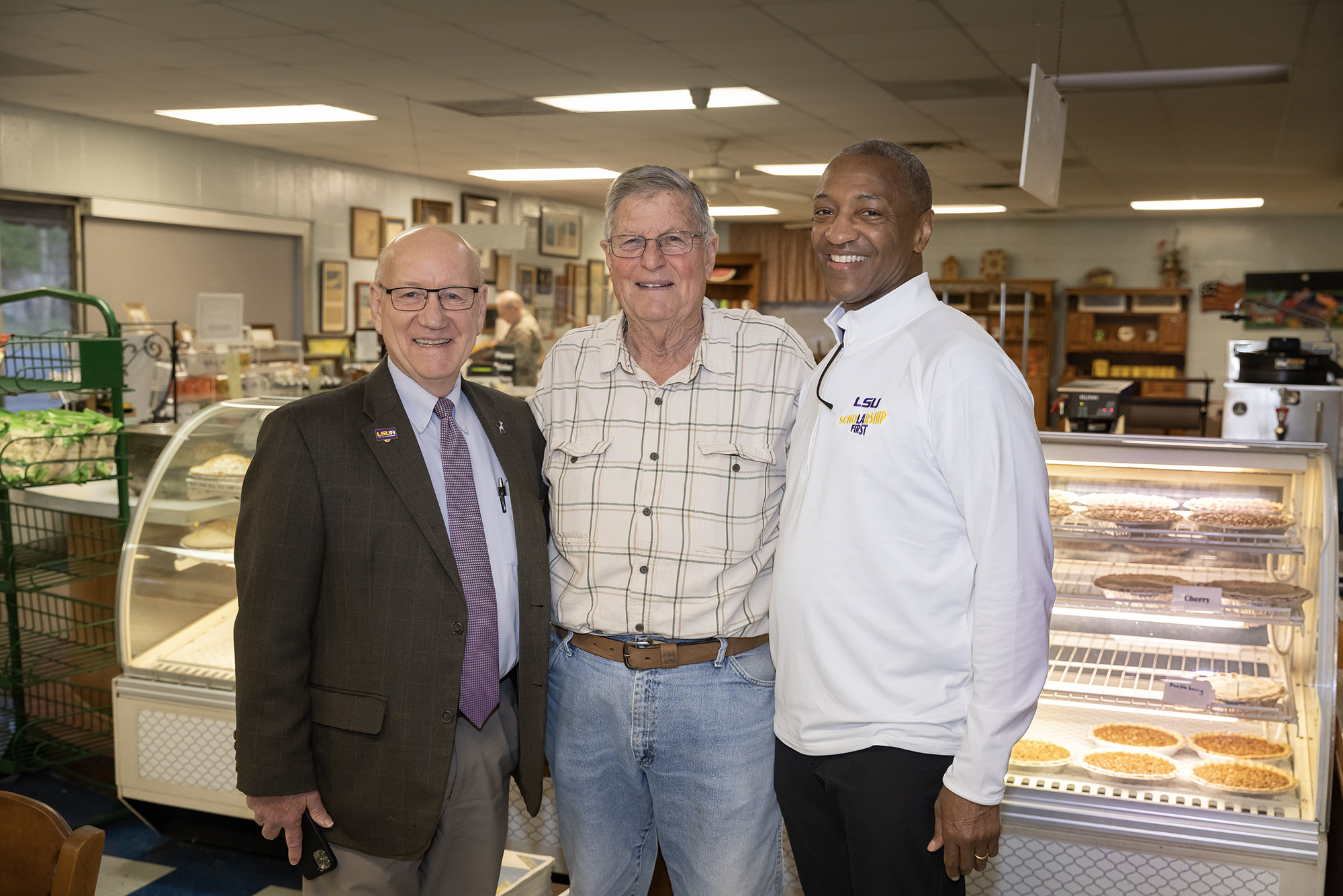 President Tate posing with others at Lea's Lunchroom
