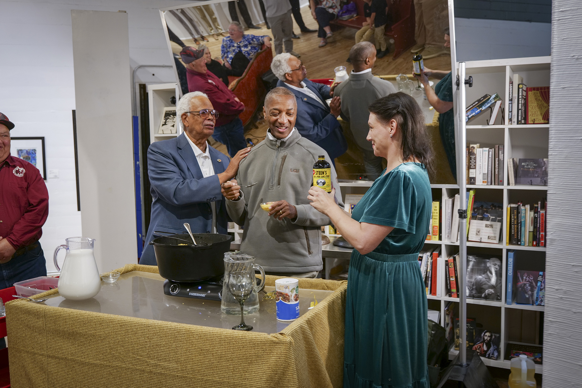 President Tate gets a French cooking demo with Paul Cluse and Ashlee Wilson