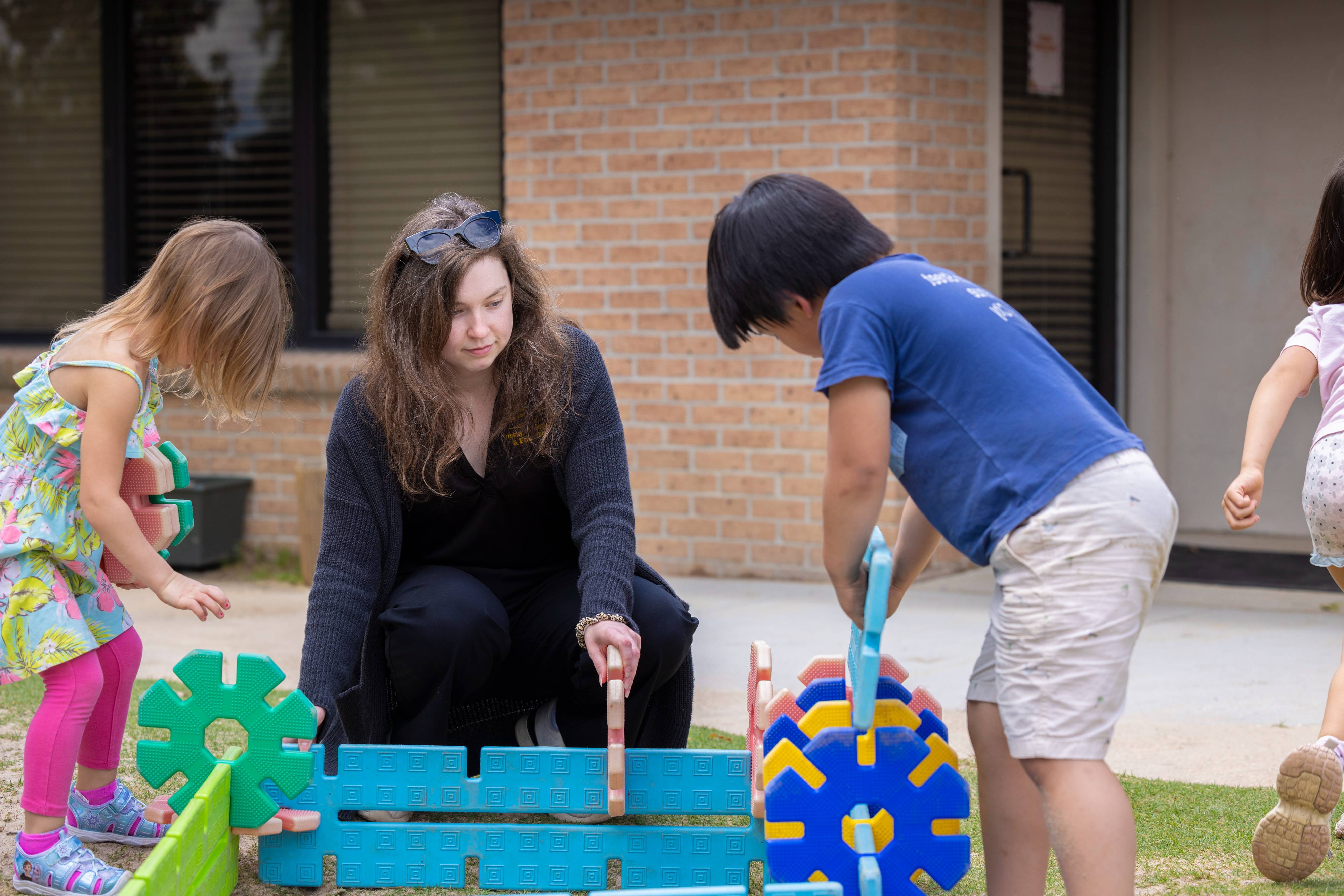 Teacher interacts with preschool students