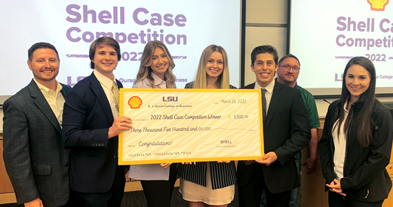Students competition winners hold a large check