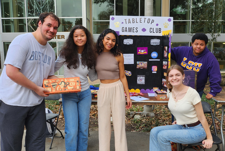 games club students in front of their table at involvement fest
