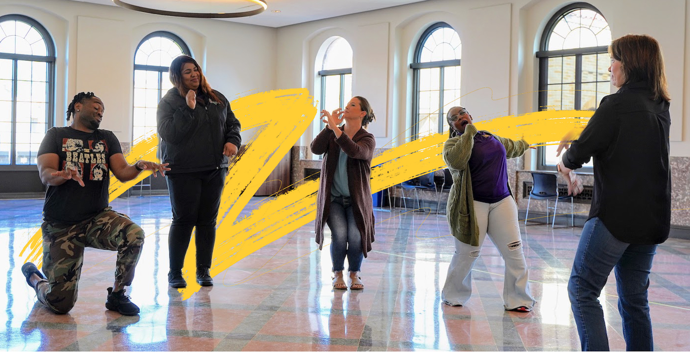 Fellows Adults pretending to play instruments with yellow tiger stroke background