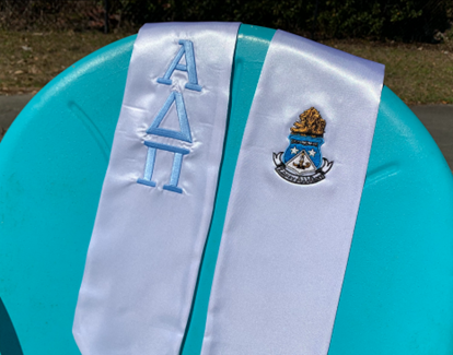 Blue and white Alpha Delta Pi embroidered stole. The stole holds our crest and greek letter name.