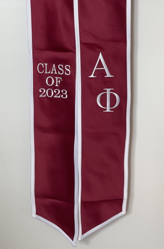 red stole with white trim for alpha phi fraternity