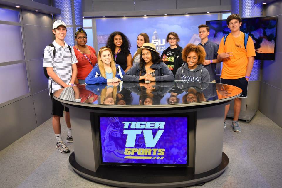 High school students behind the Tiger TV desk