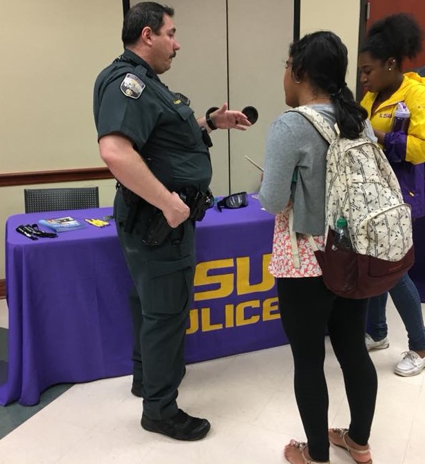 officer sharing information with students