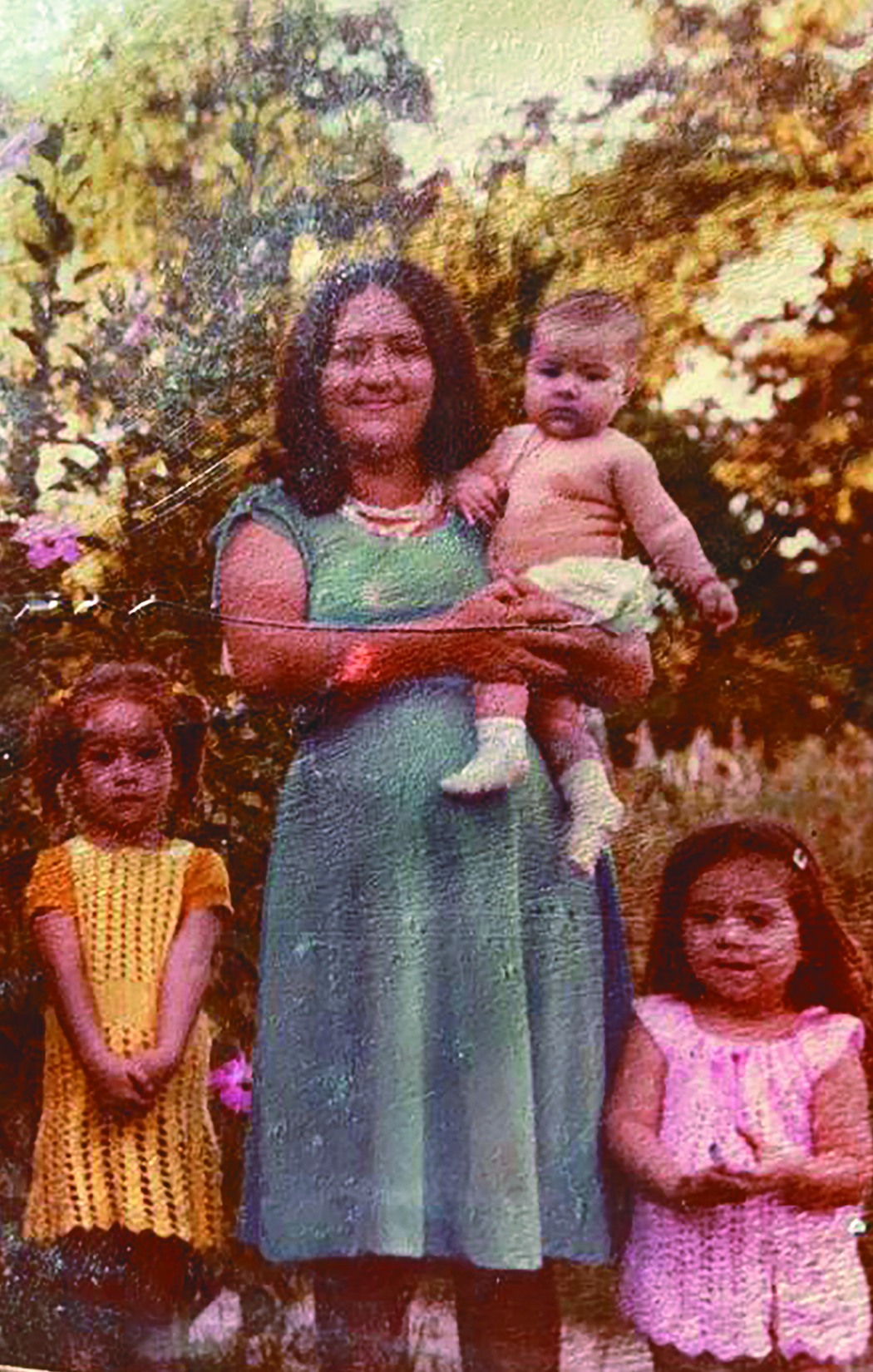 Fatima Rivas as a baby with her mother and two older sisters