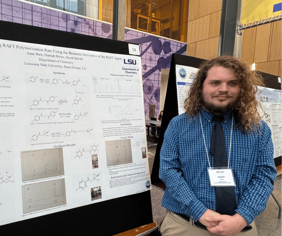 Isaac in front of his poster